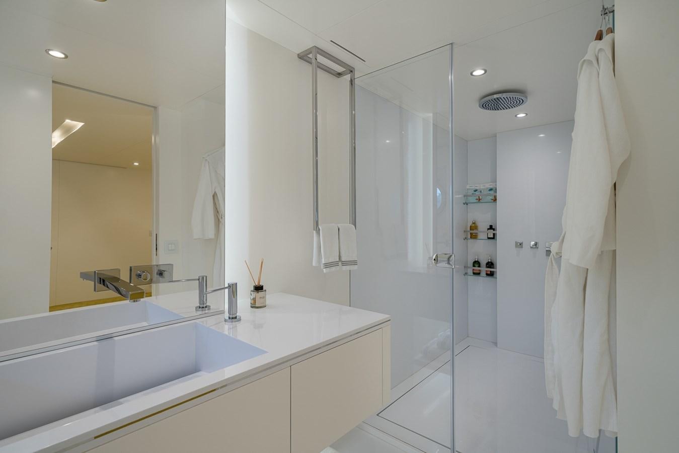 a bathroom with a large mirror aboard ESOSH Yacht for Sale