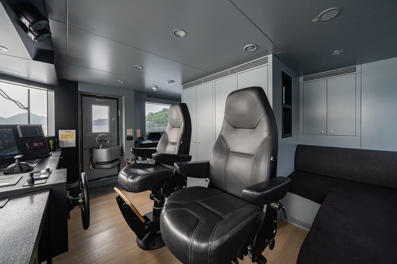 a room with a couch and a desk aboard ESOSH Yacht for Sale