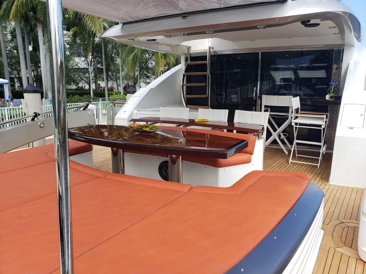 a room with a table and chairs aboard LANIDA Yacht for Sale