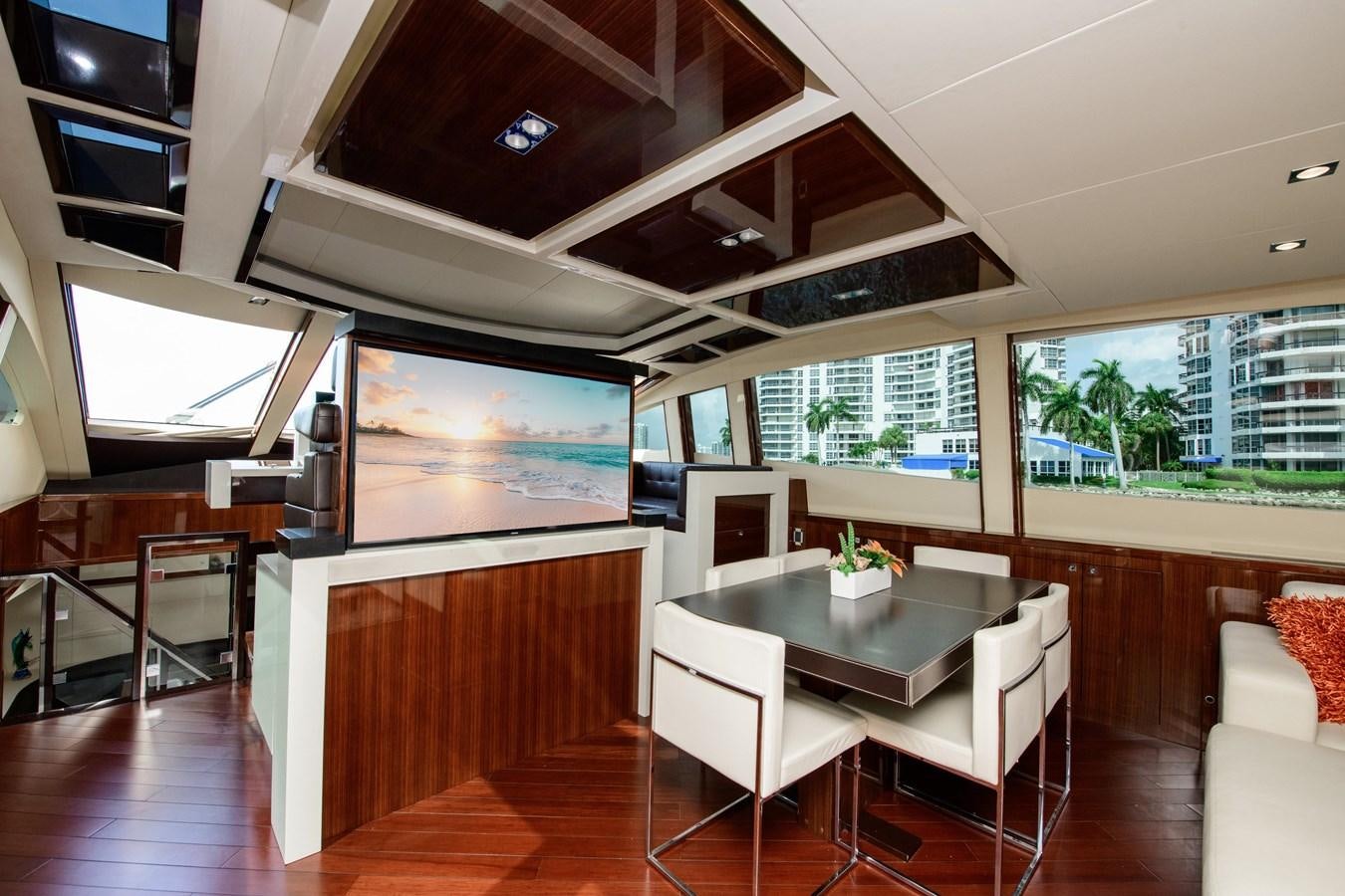 a room with a table and chairs aboard LANIDA Yacht for Sale