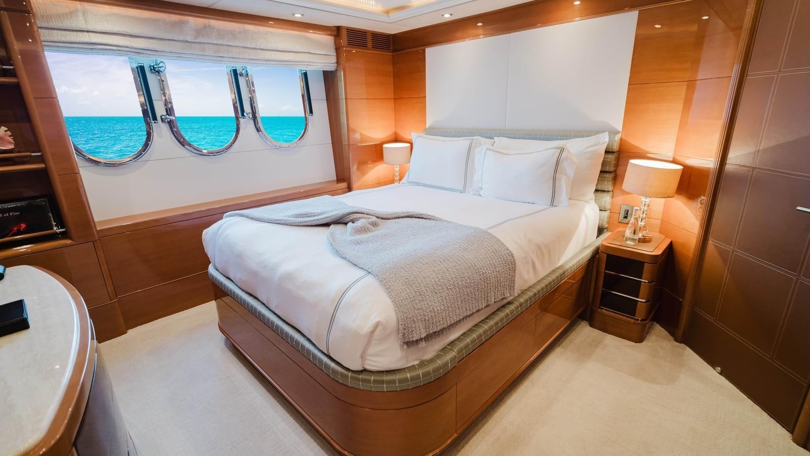 a bed with a white bed aboard GROOVER Yacht for Sale