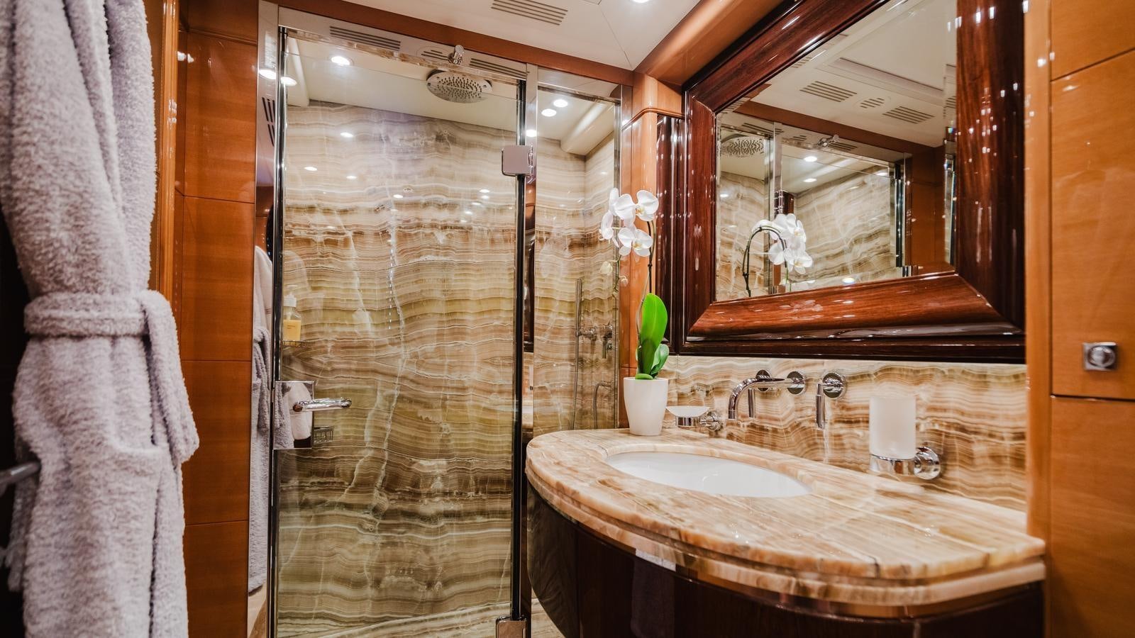 a bathroom with a large mirror aboard GROOVER Yacht for Sale