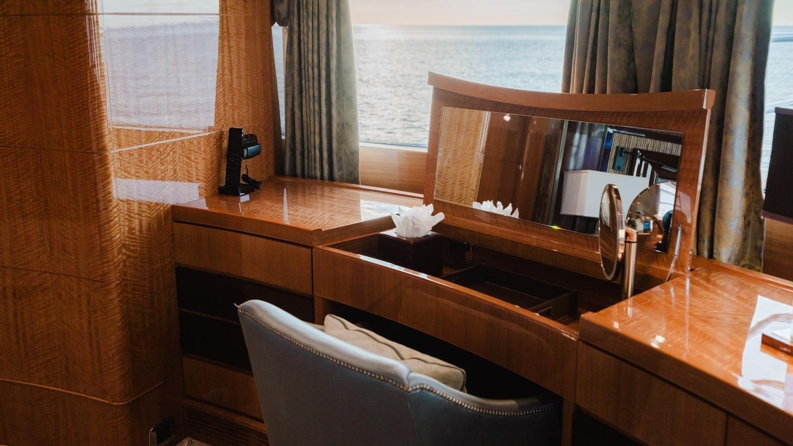 a room with a chair and a piano aboard GROOVER Yacht for Sale