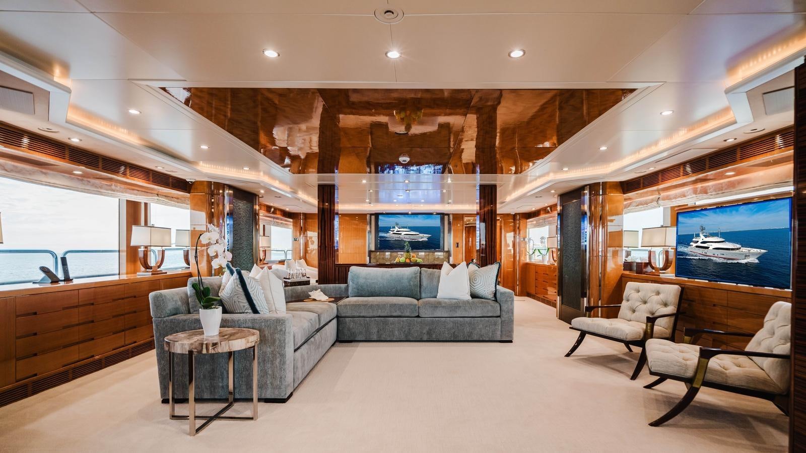 a living room with a large window aboard GROOVER Yacht for Sale