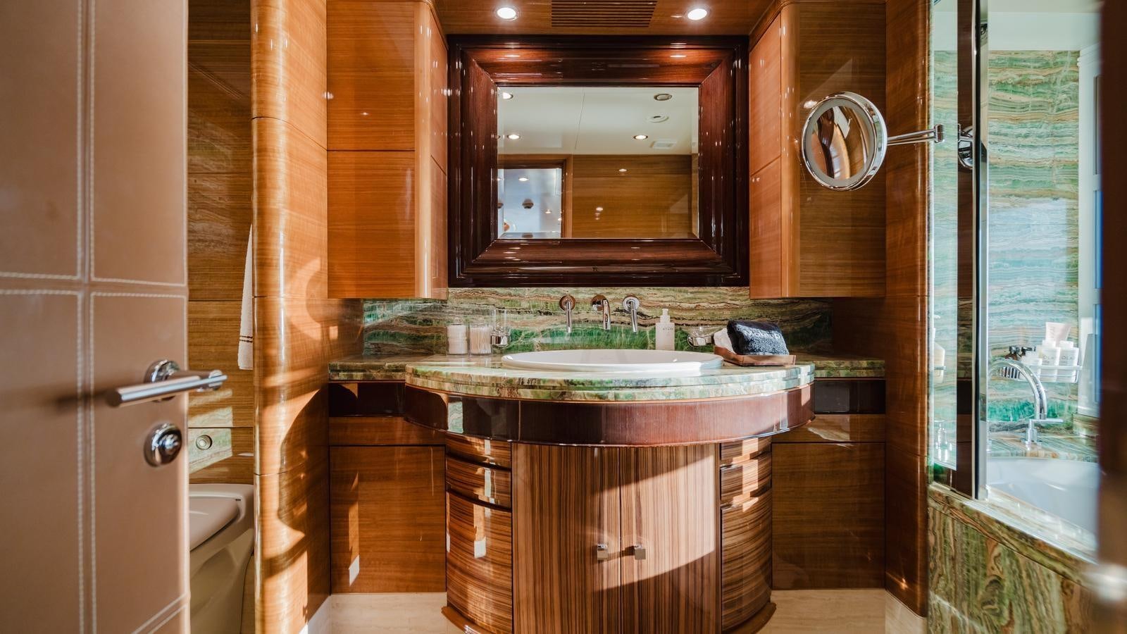 a bathroom with a sink and a mirror aboard GROOVER Yacht for Sale