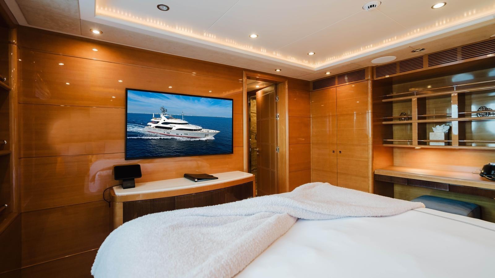 a room with a television and a bed aboard GROOVER Yacht for Sale