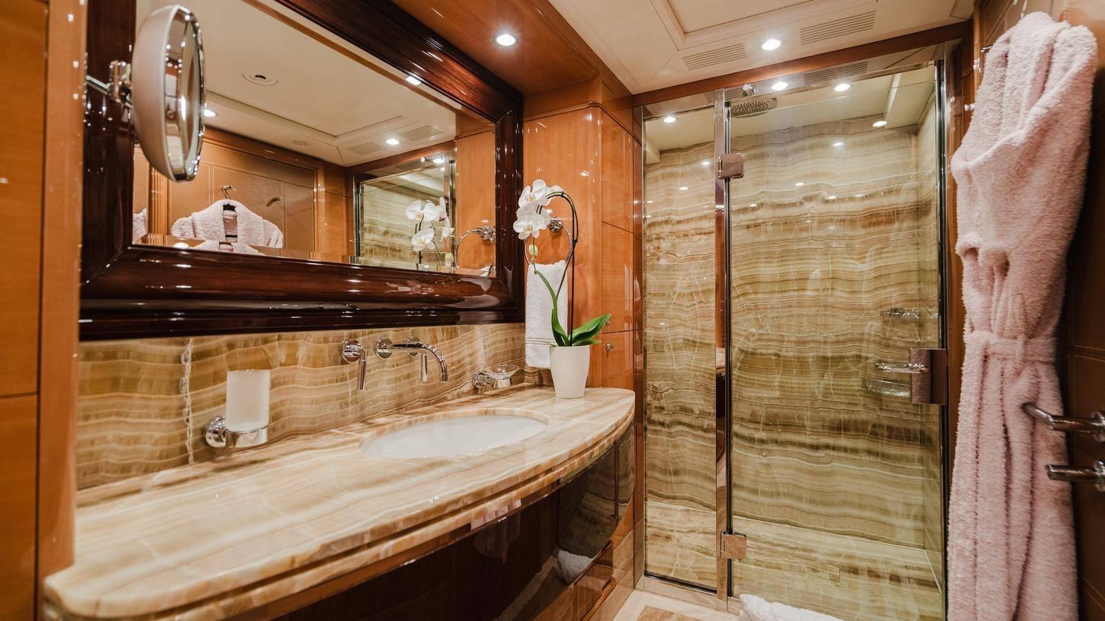 a bathroom with a large mirror aboard GROOVER Yacht for Sale