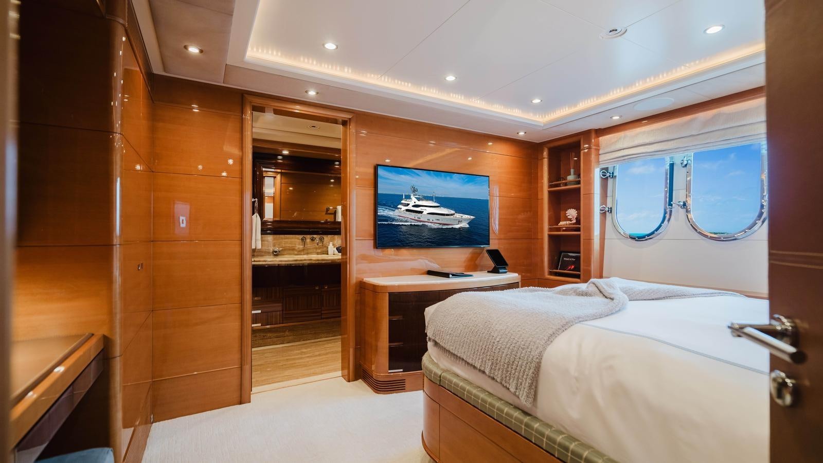 a room with a bed and a tv aboard GROOVER Yacht for Sale
