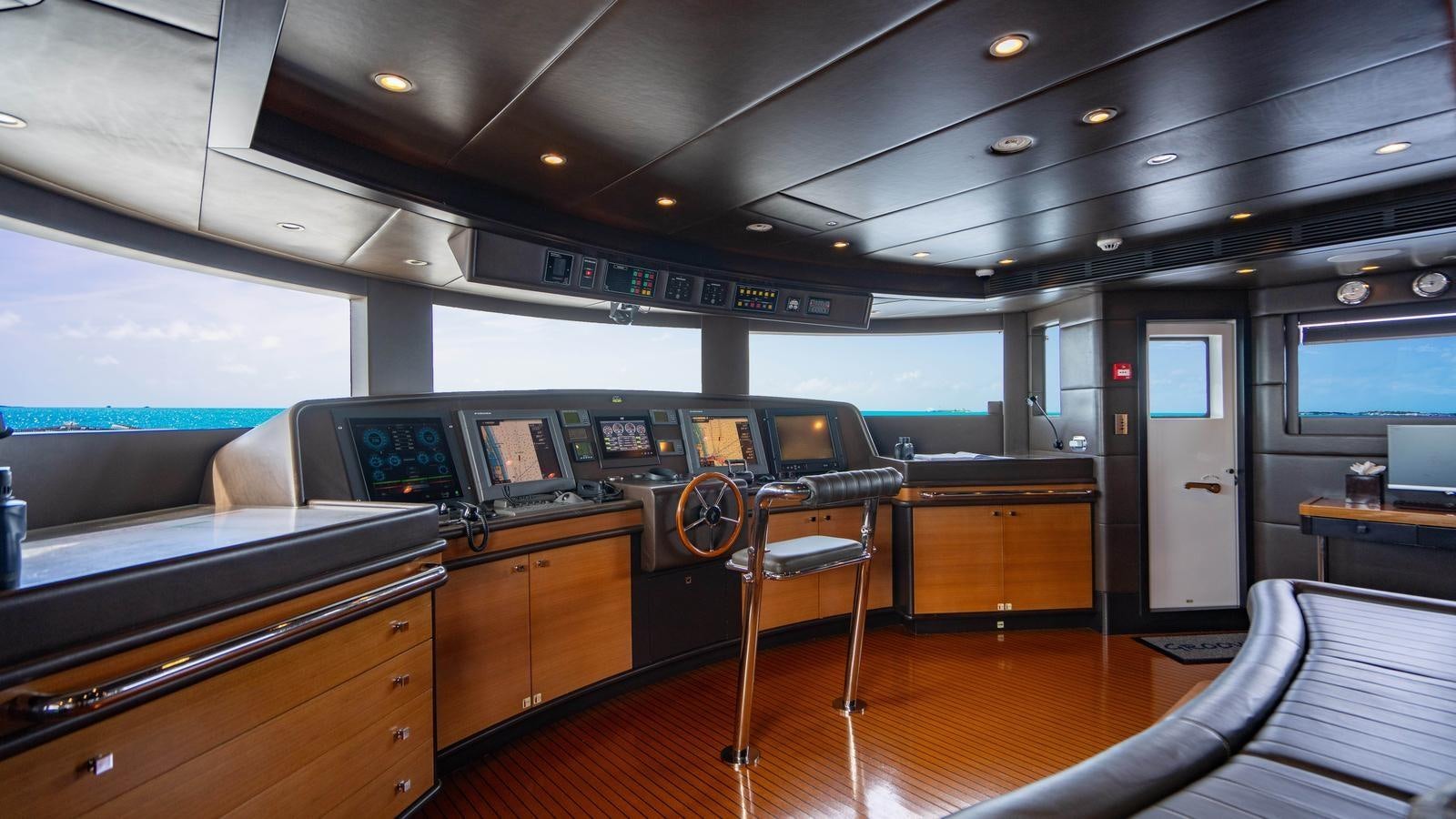 a room with a desk and chairs aboard GROOVER Yacht for Sale