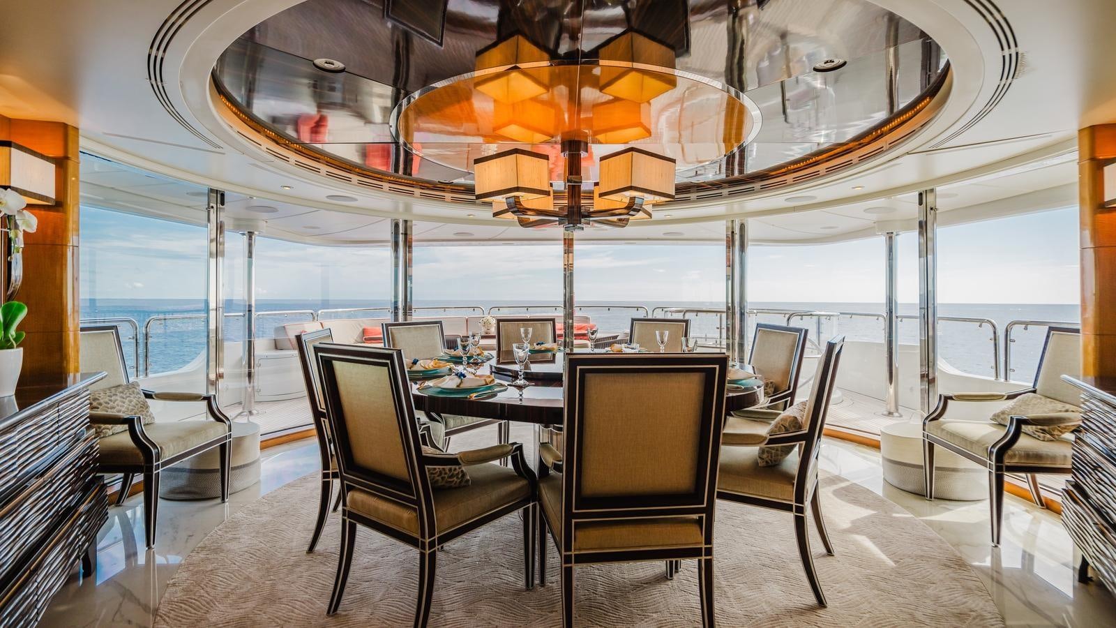 a large dining room with a table and chairs aboard GROOVER Yacht for Sale