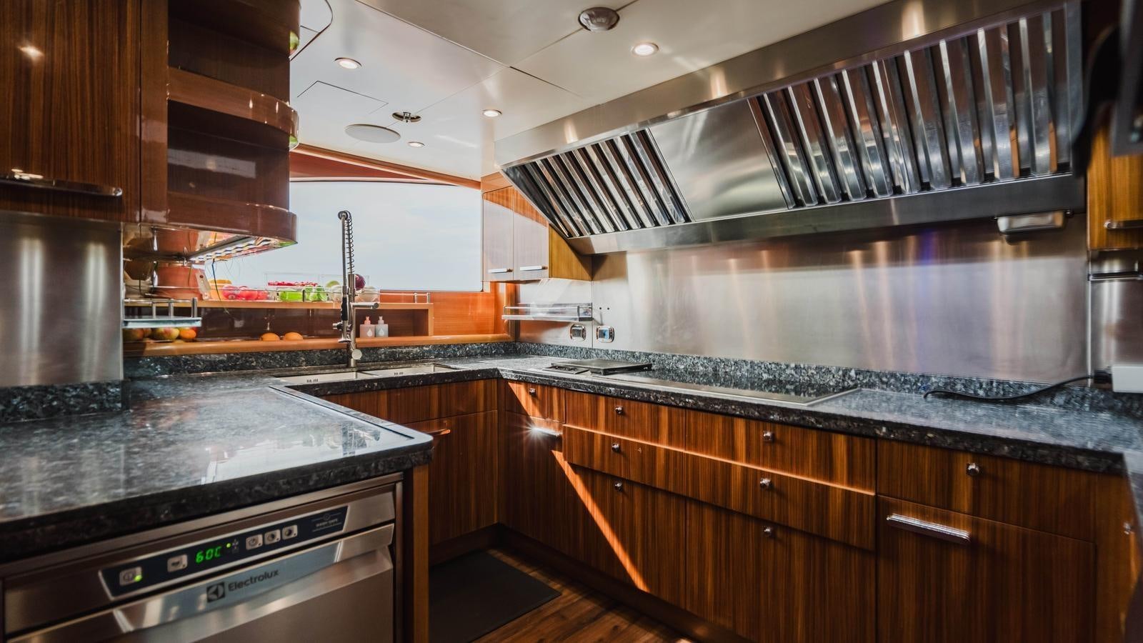 a kitchen with a steel stove aboard GROOVER Yacht for Sale