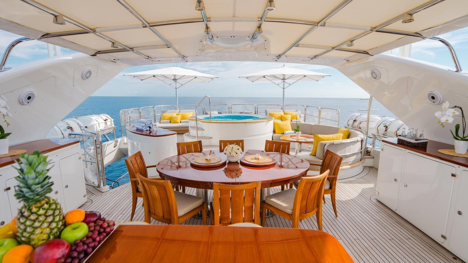 a large room with a table and chairs and a large tent aboard GROOVER Yacht for Sale