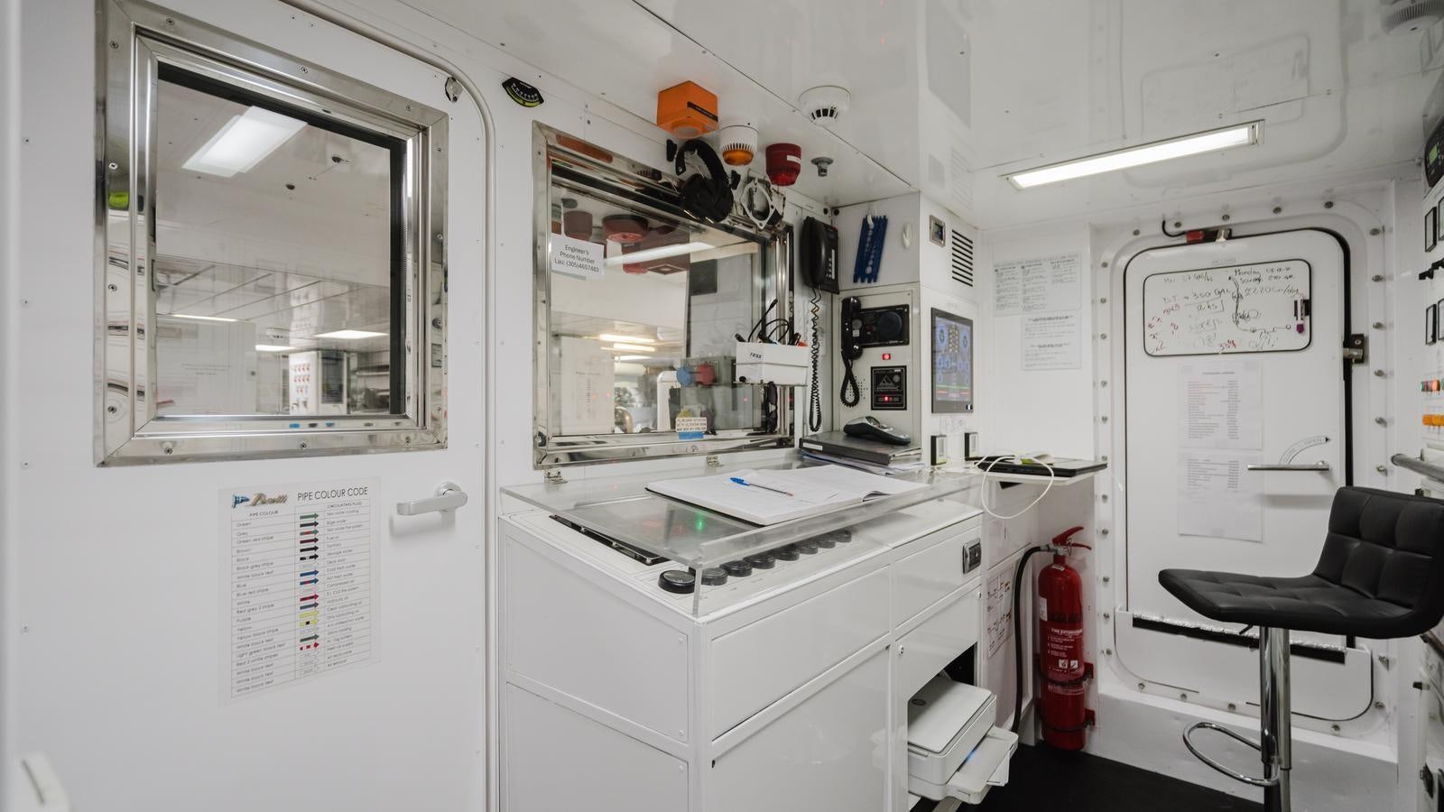 a room with a chair and a desk aboard GROOVER Yacht for Sale