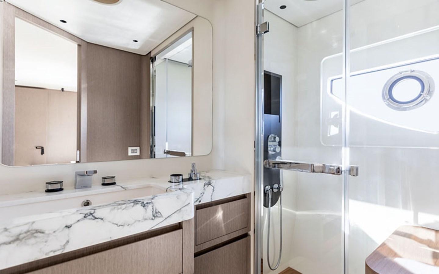 a bathroom with a large mirror aboard BREEZE Yacht for Sale