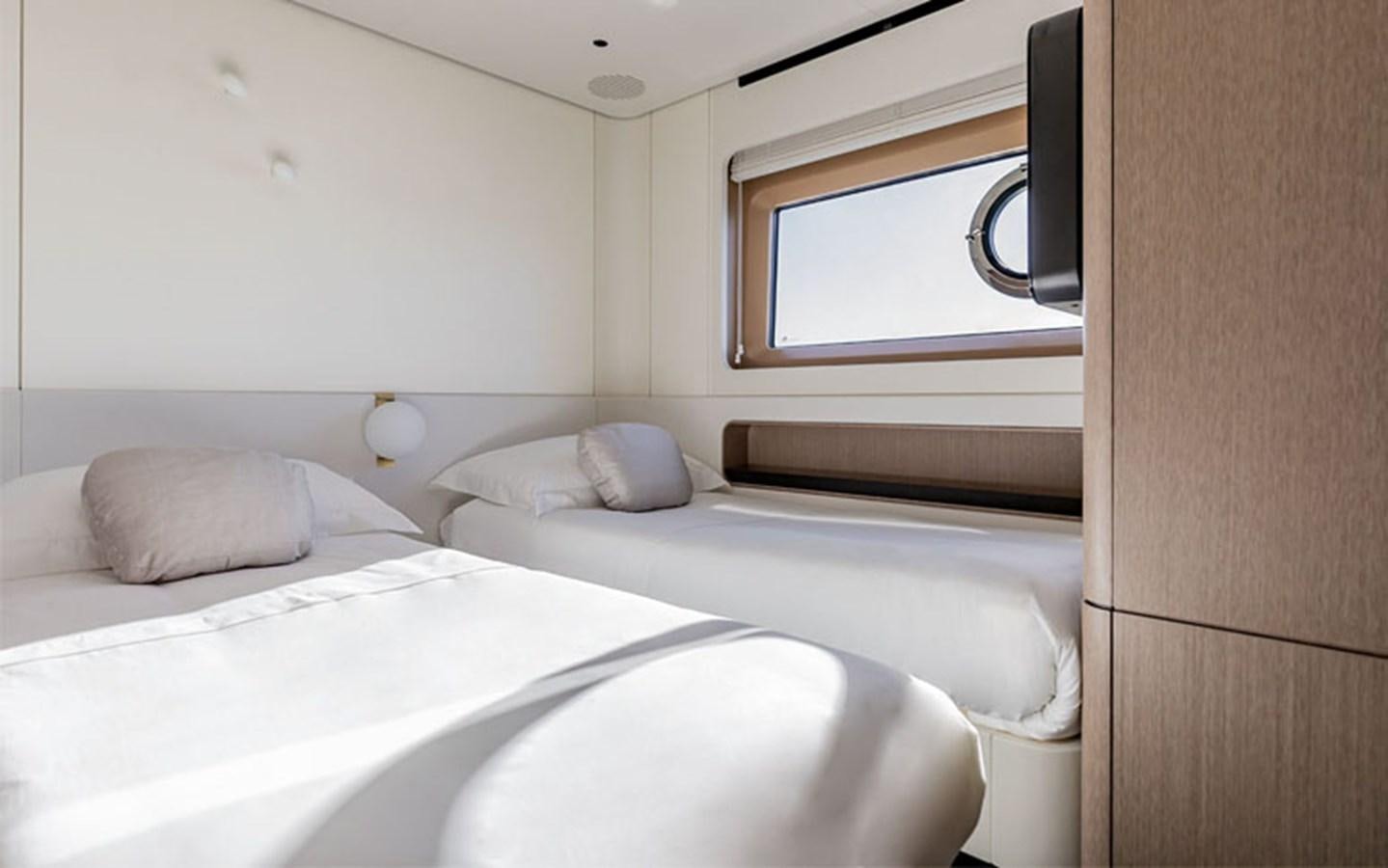 a couple of beds in a room aboard BREEZE Yacht for Sale