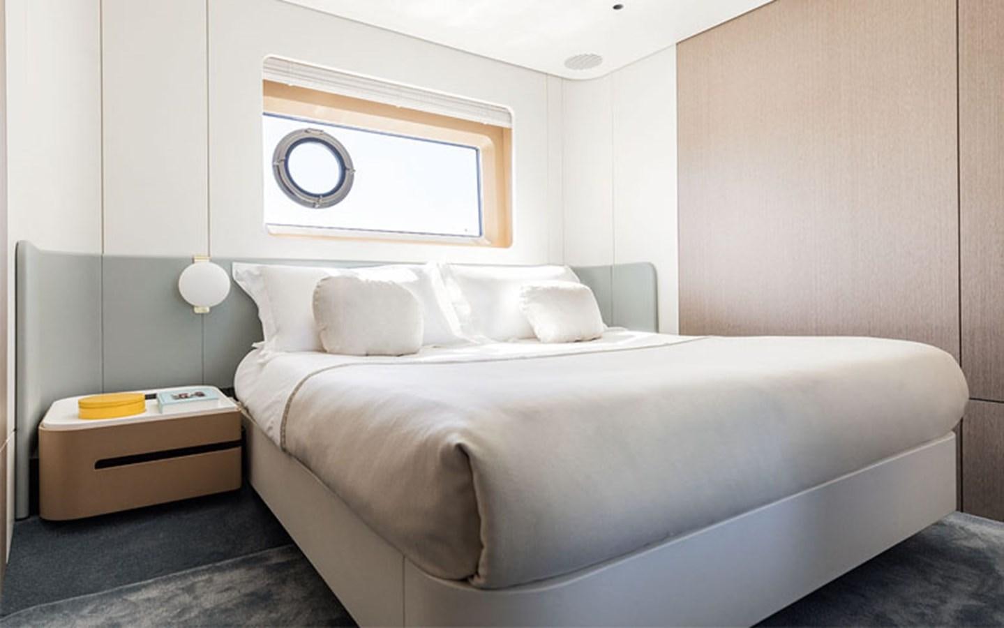 a bed with white sheets aboard BREEZE Yacht for Sale
