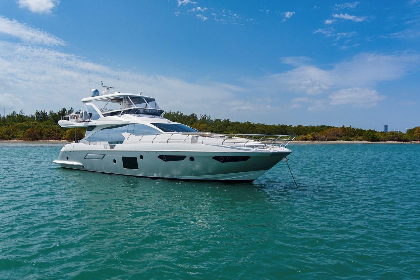 a white yacht in the water aboard GRATITUDE Yacht for Sale