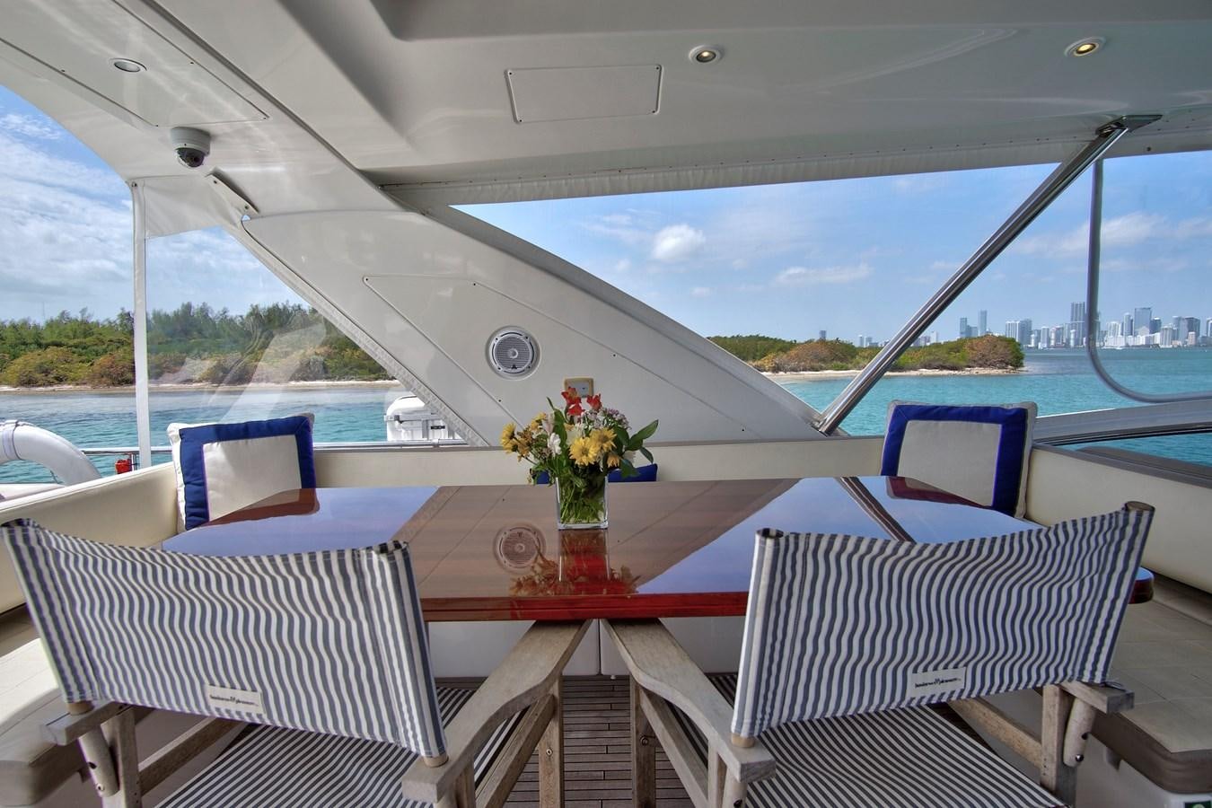 a boat with chairs and tables aboard GRATITUDE Yacht for Sale