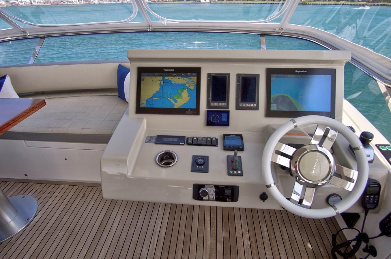 a white boat with a screen aboard GRATITUDE Yacht for Sale