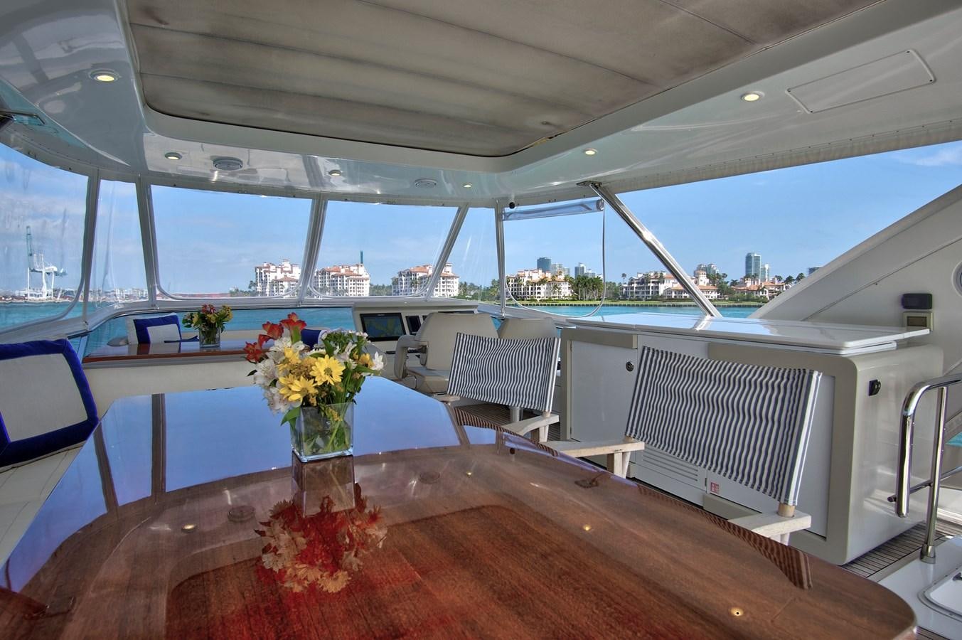 a table with flowers in a boat aboard GRATITUDE Yacht for Sale