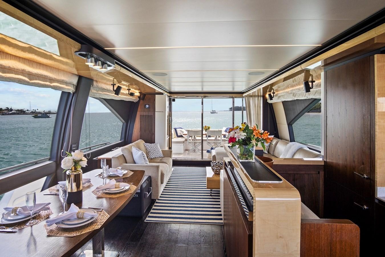 a room with a table and chairs aboard GRATITUDE Yacht for Sale