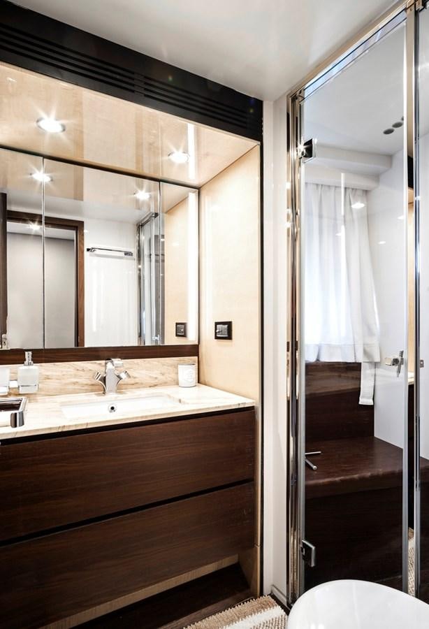 a bathroom with a large mirror aboard GRATITUDE Yacht for Sale