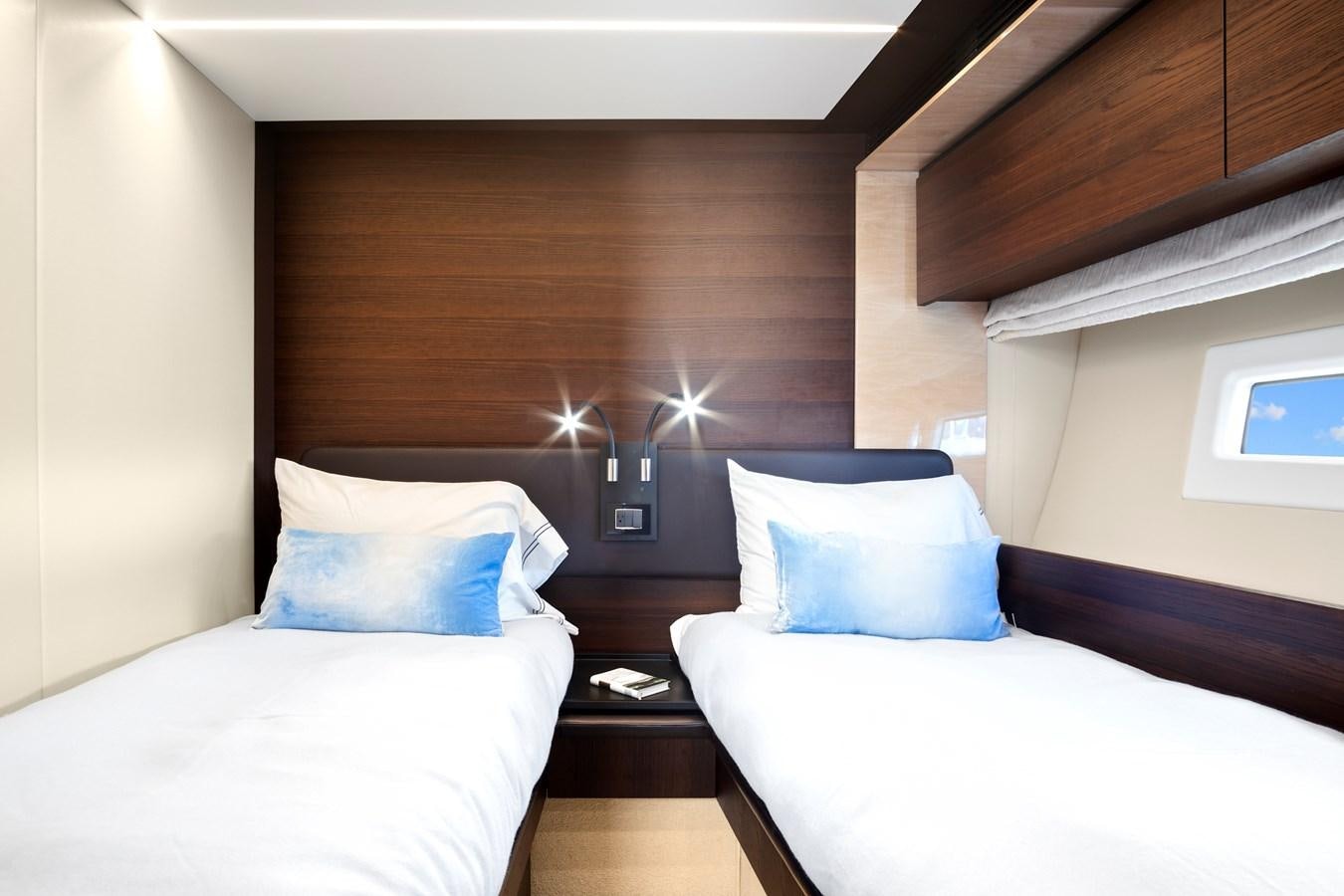 a room with two beds aboard GRATITUDE Yacht for Sale