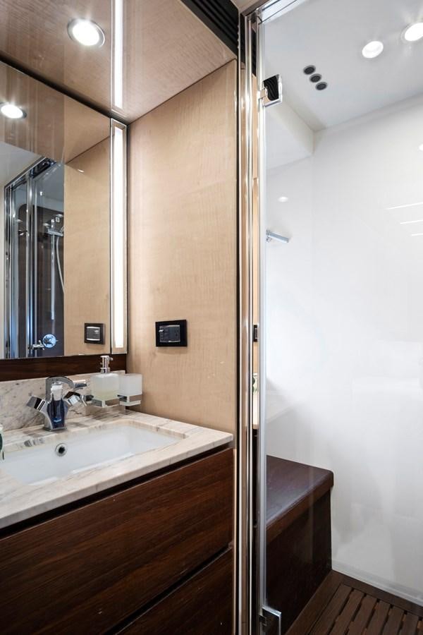a bathroom with a sink and a mirror aboard GRATITUDE Yacht for Sale