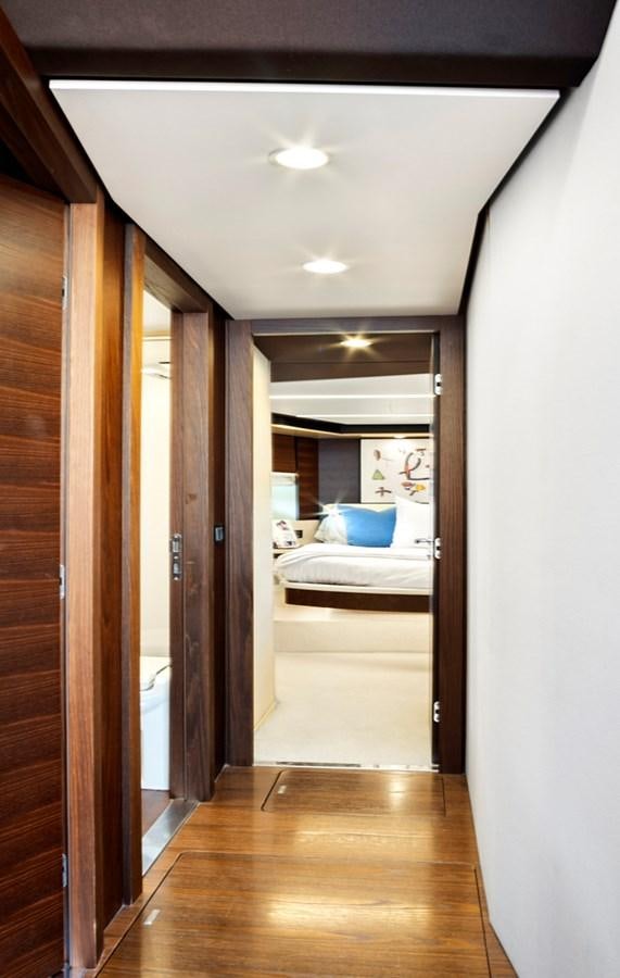 a room with a bed and a mirror aboard GRATITUDE Yacht for Sale