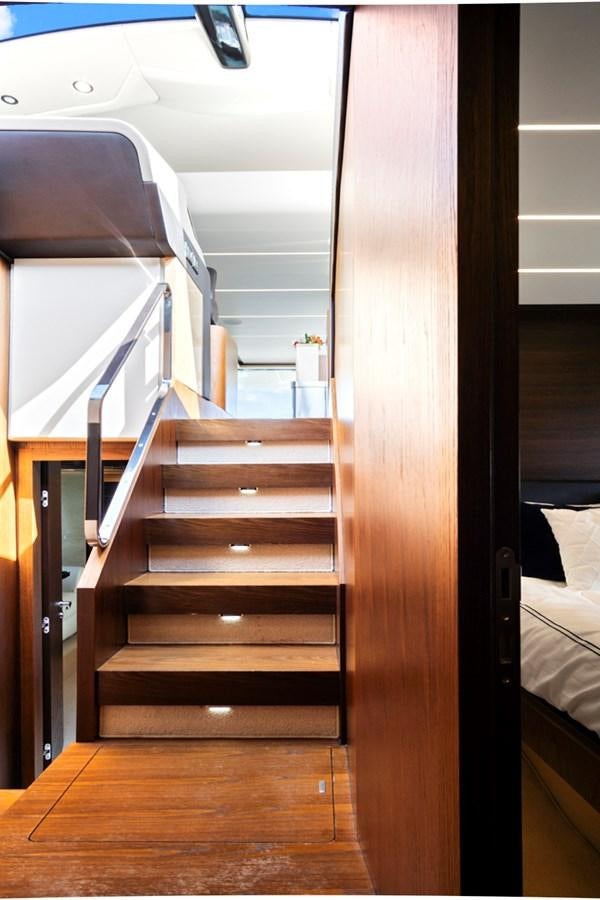 a wooden staircase in a room aboard GRATITUDE Yacht for Sale