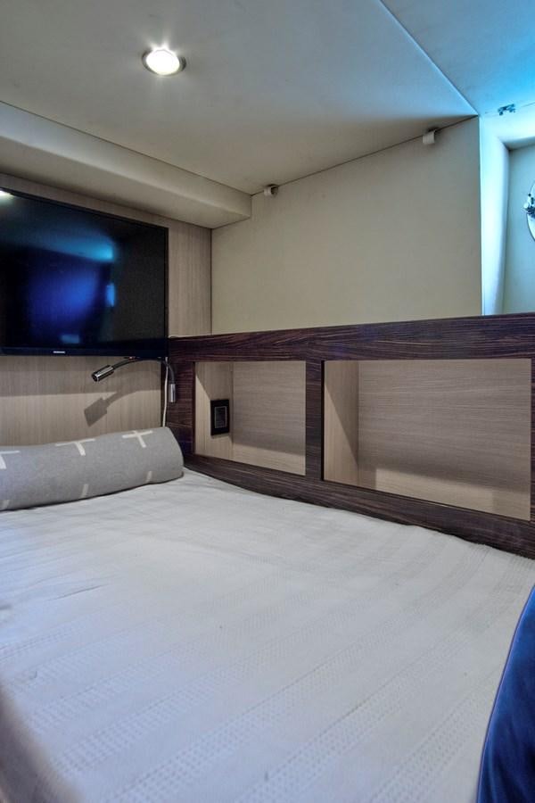 a bed with a white sheet aboard GRATITUDE Yacht for Sale