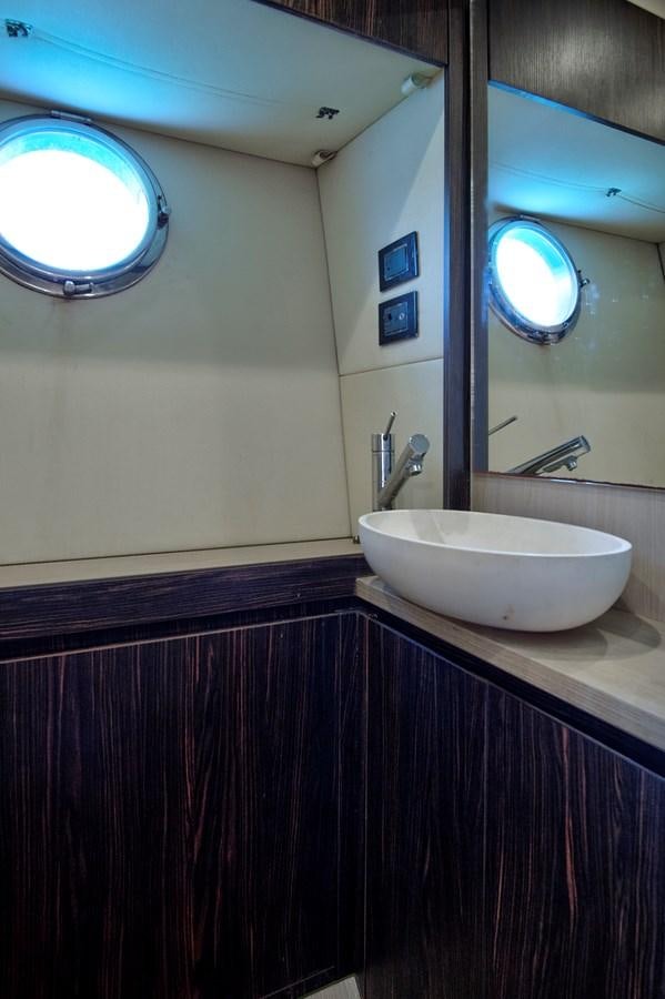 a bathroom with a sink and a mirror aboard GRATITUDE Yacht for Sale