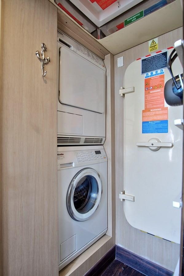 a washer and dryer in a room aboard GRATITUDE Yacht for Sale