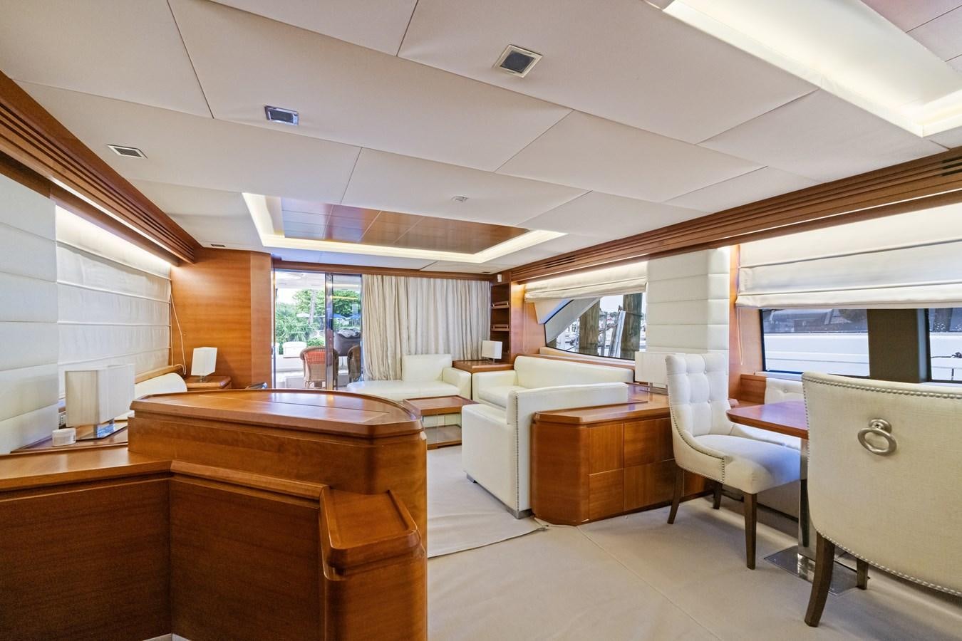 a large room with a table and chairs aboard AZIMUT 85 FLY Yacht for Sale