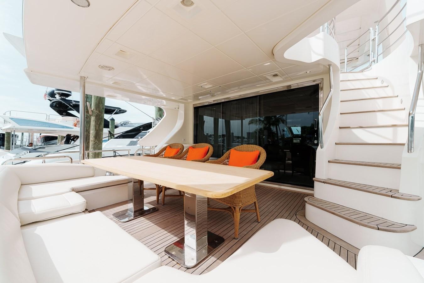 a room with a table and chairs aboard AZIMUT 85 FLY Yacht for Sale