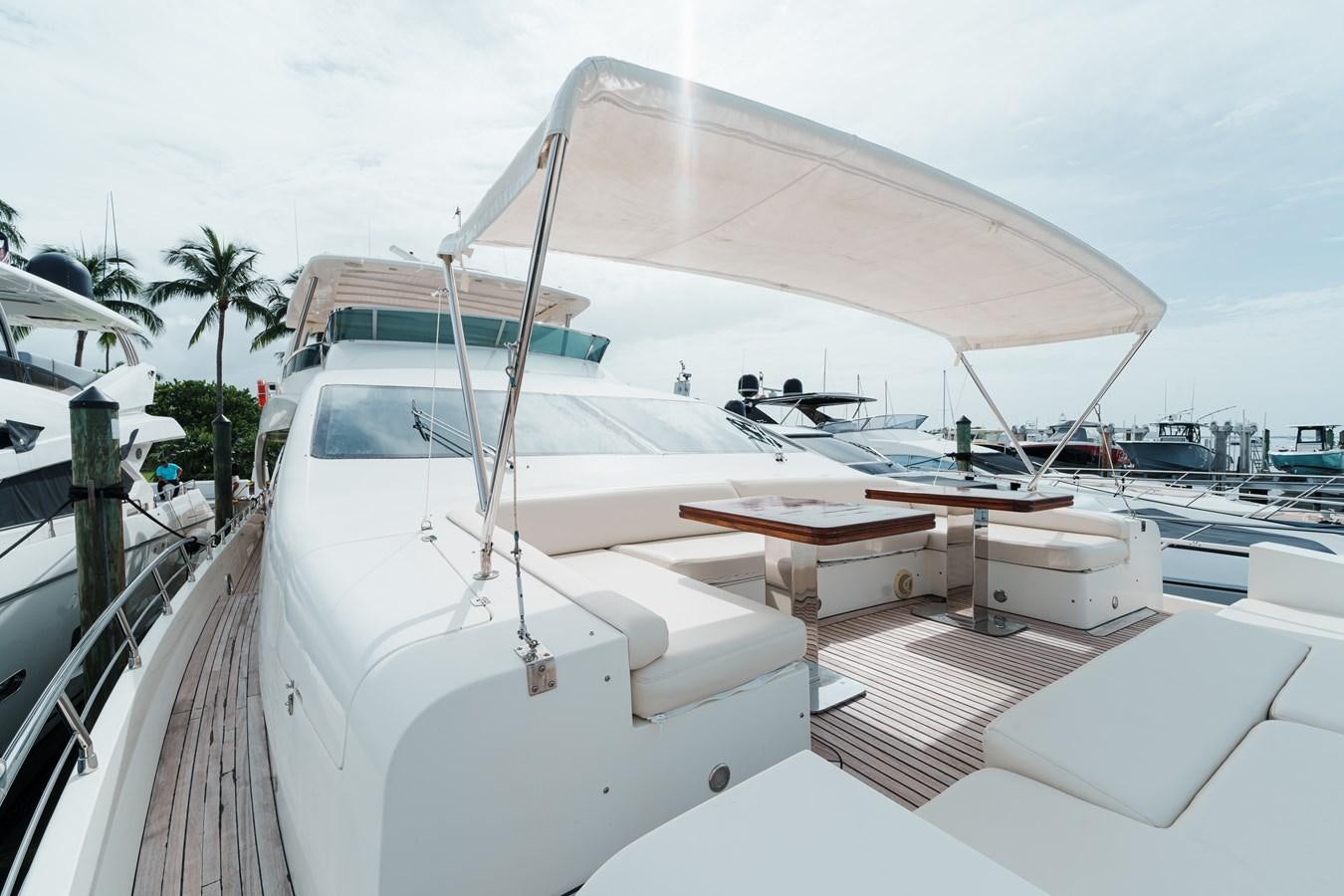 a white boat with a white canopy aboard AZIMUT 85 FLY Yacht for Sale