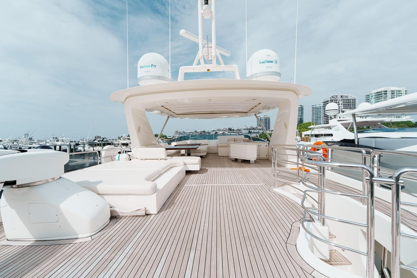 a deck with a deck and a view of a city aboard AZIMUT 85 FLY Yacht for Sale
