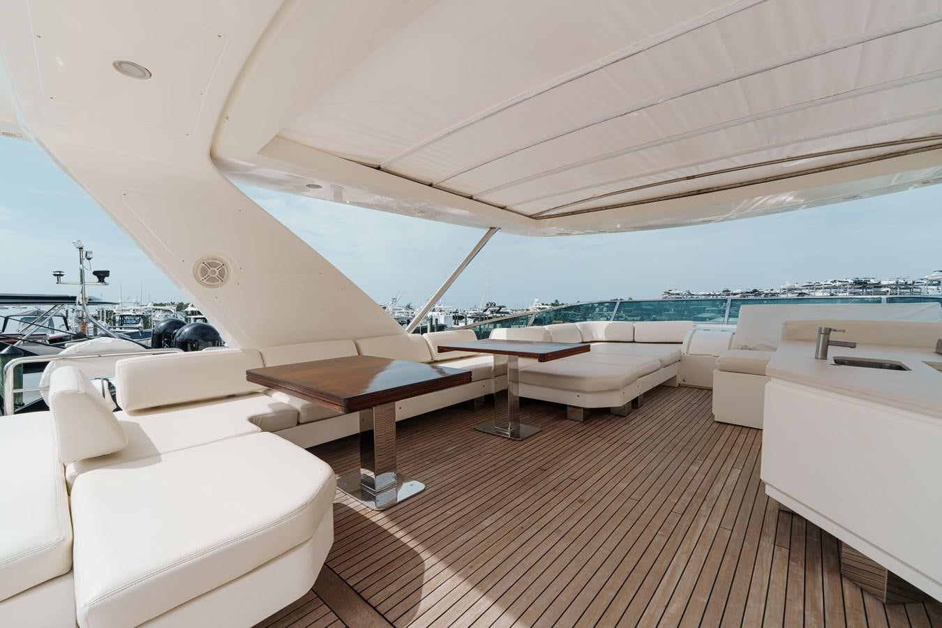 a room with a table and chairs aboard AZIMUT 85 FLY Yacht for Sale