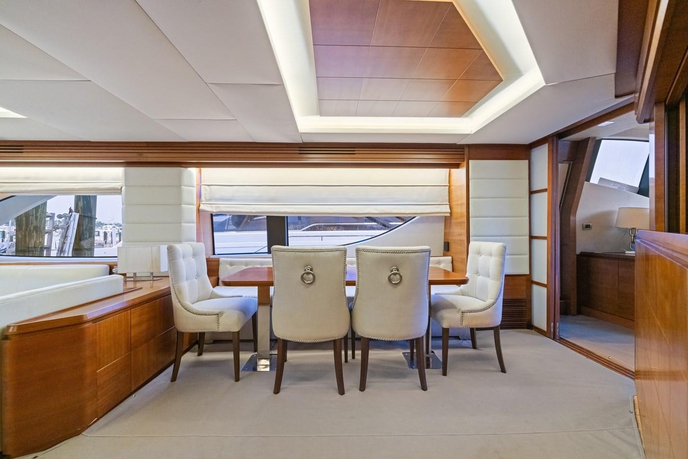 a room with a table and chairs aboard AZIMUT 85 FLY Yacht for Sale