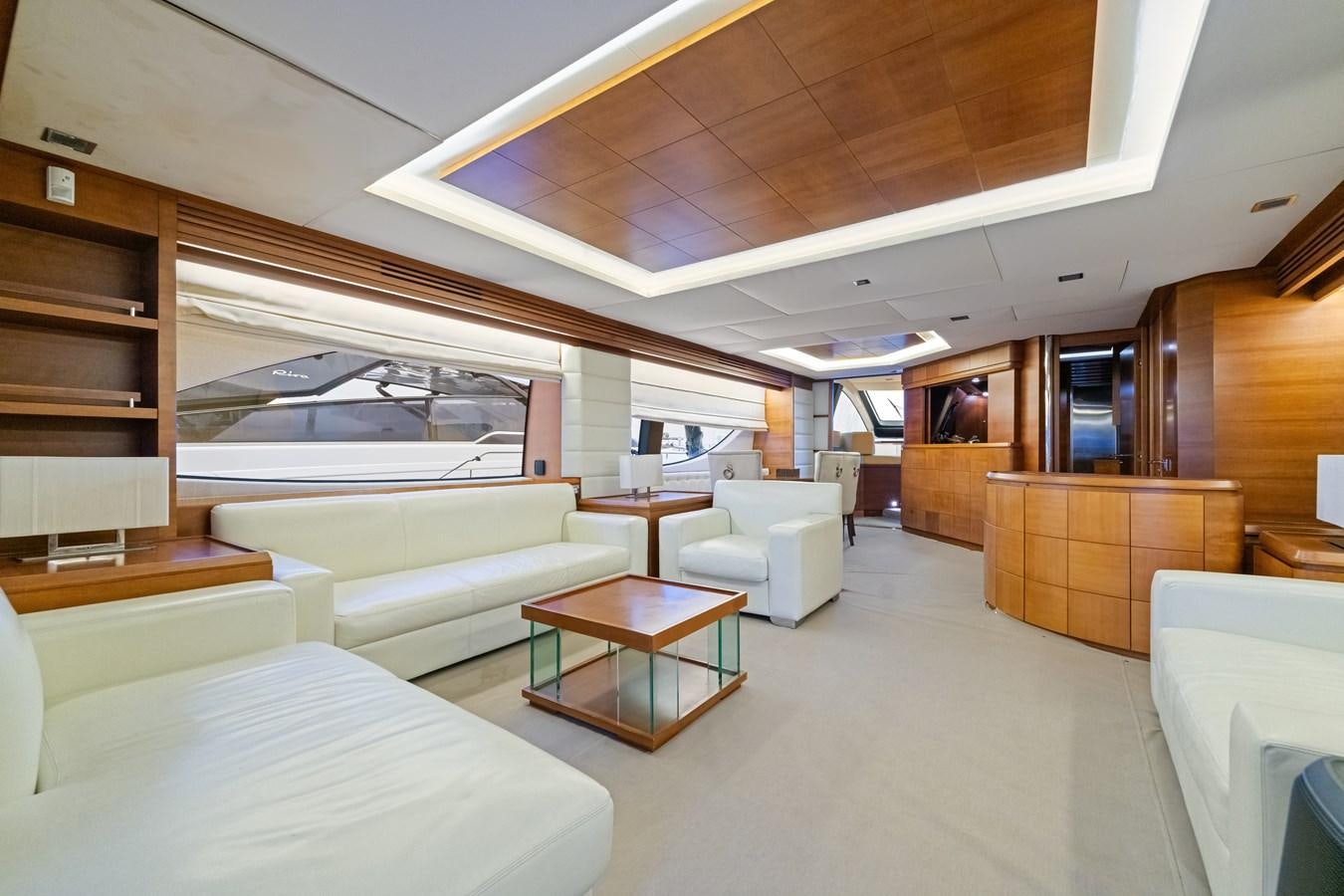 a room with a couch and a table aboard AZIMUT 85 FLY Yacht for Sale