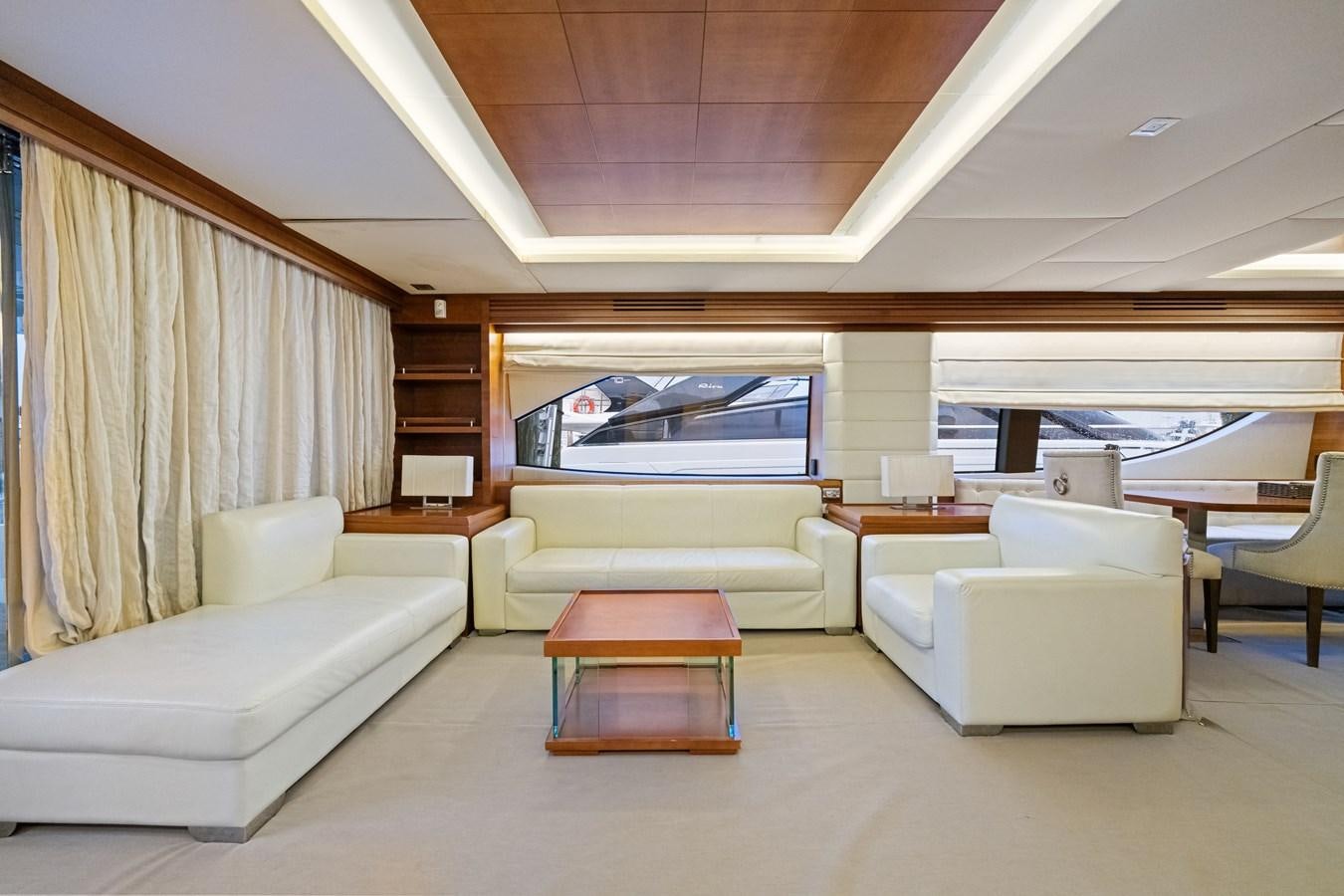 a living room with a couch and a table aboard AZIMUT 85 FLY Yacht for Sale