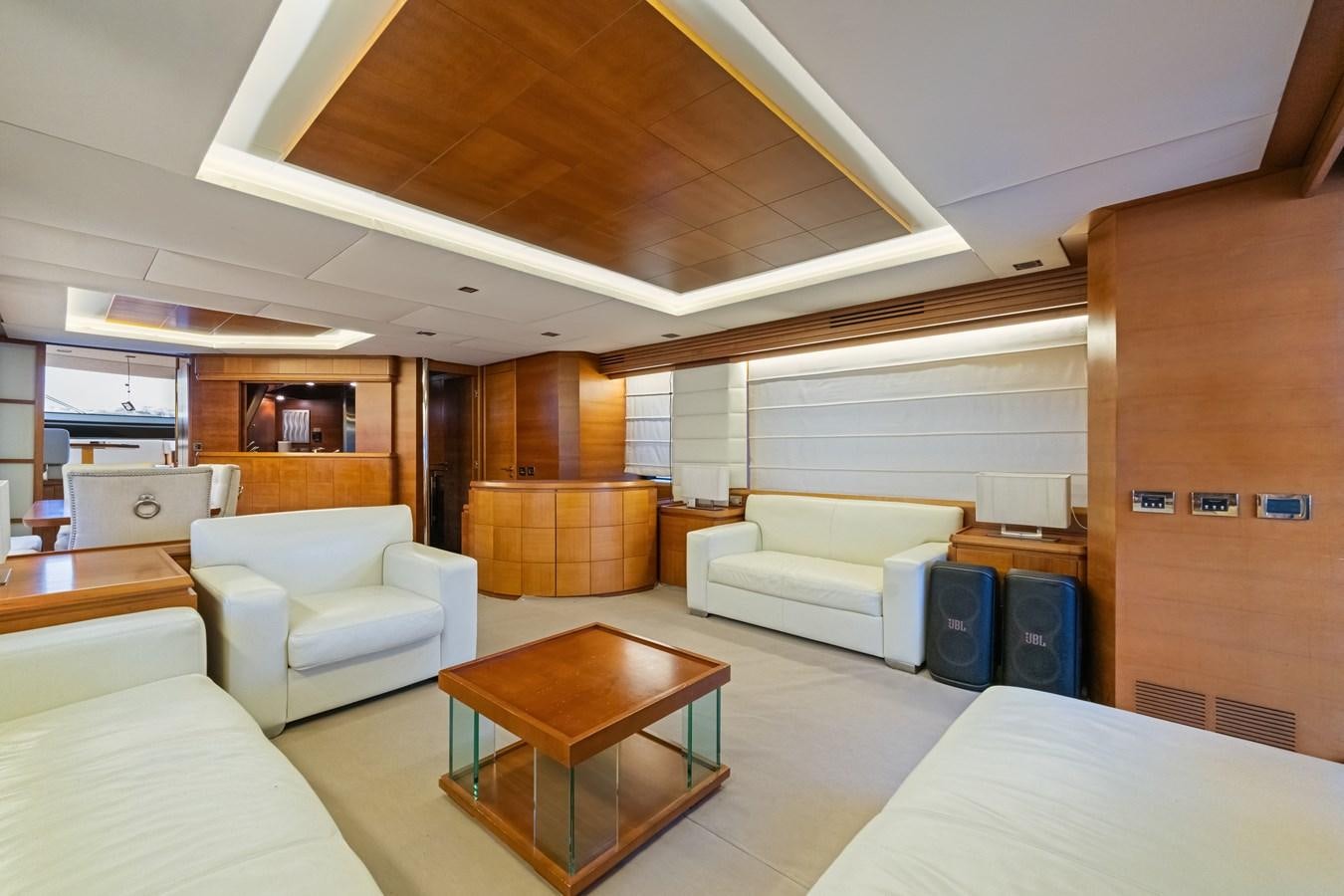a room with a table and couches aboard AZIMUT 85 FLY Yacht for Sale