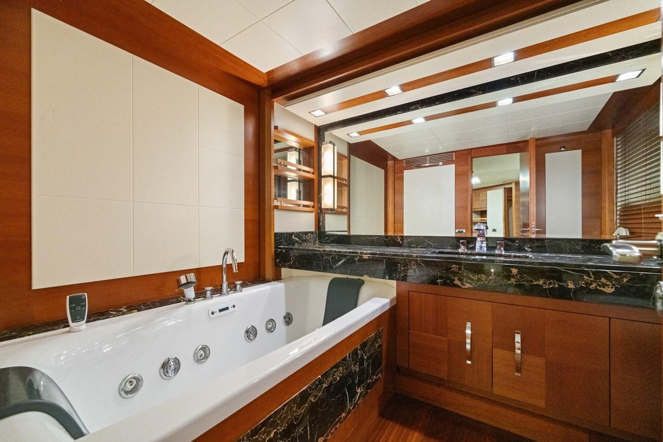 a large bathroom with a large jacuzzi tub aboard AZIMUT 85 FLY Yacht for Sale