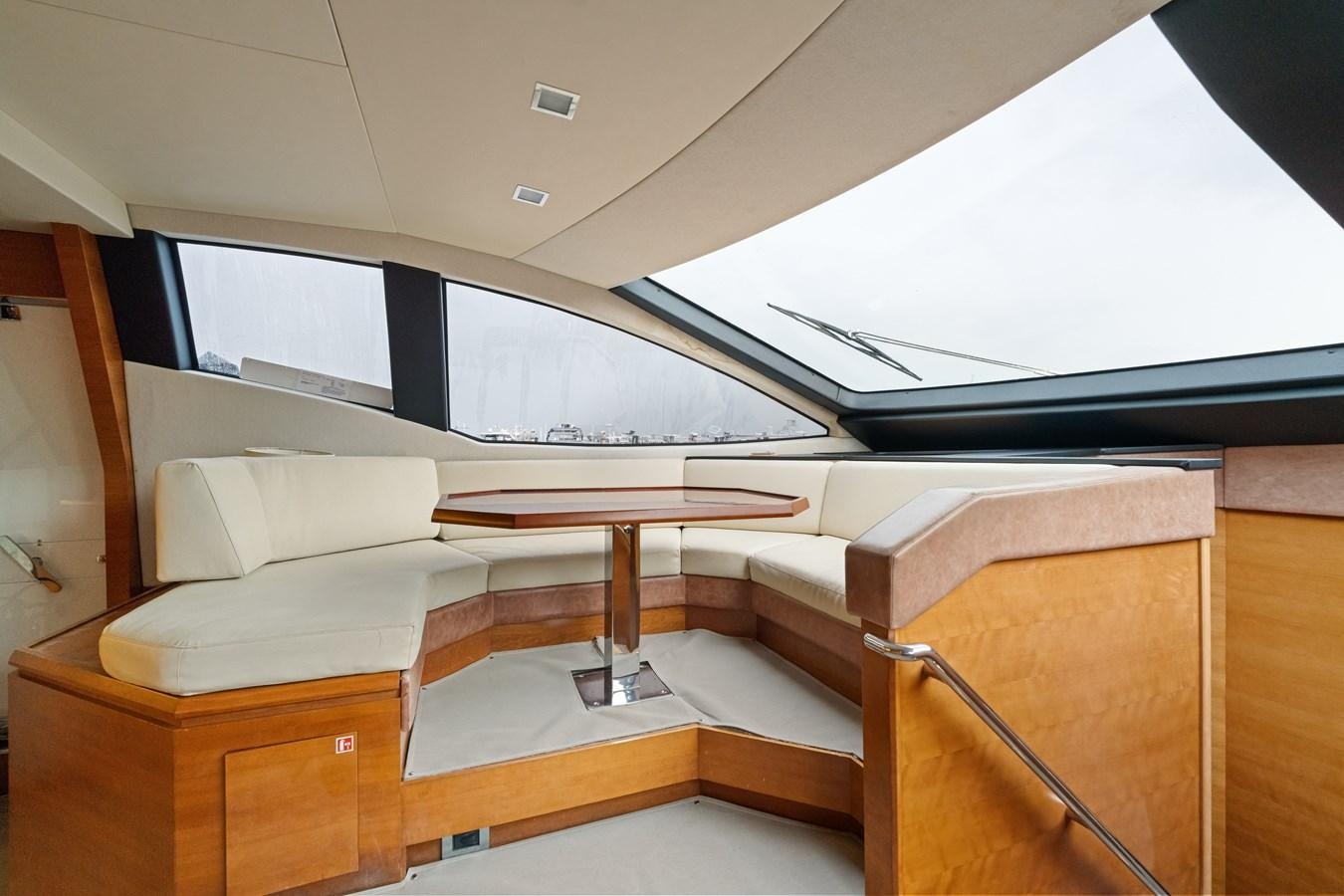 a room with a table and chairs aboard AZIMUT 85 FLY Yacht for Sale