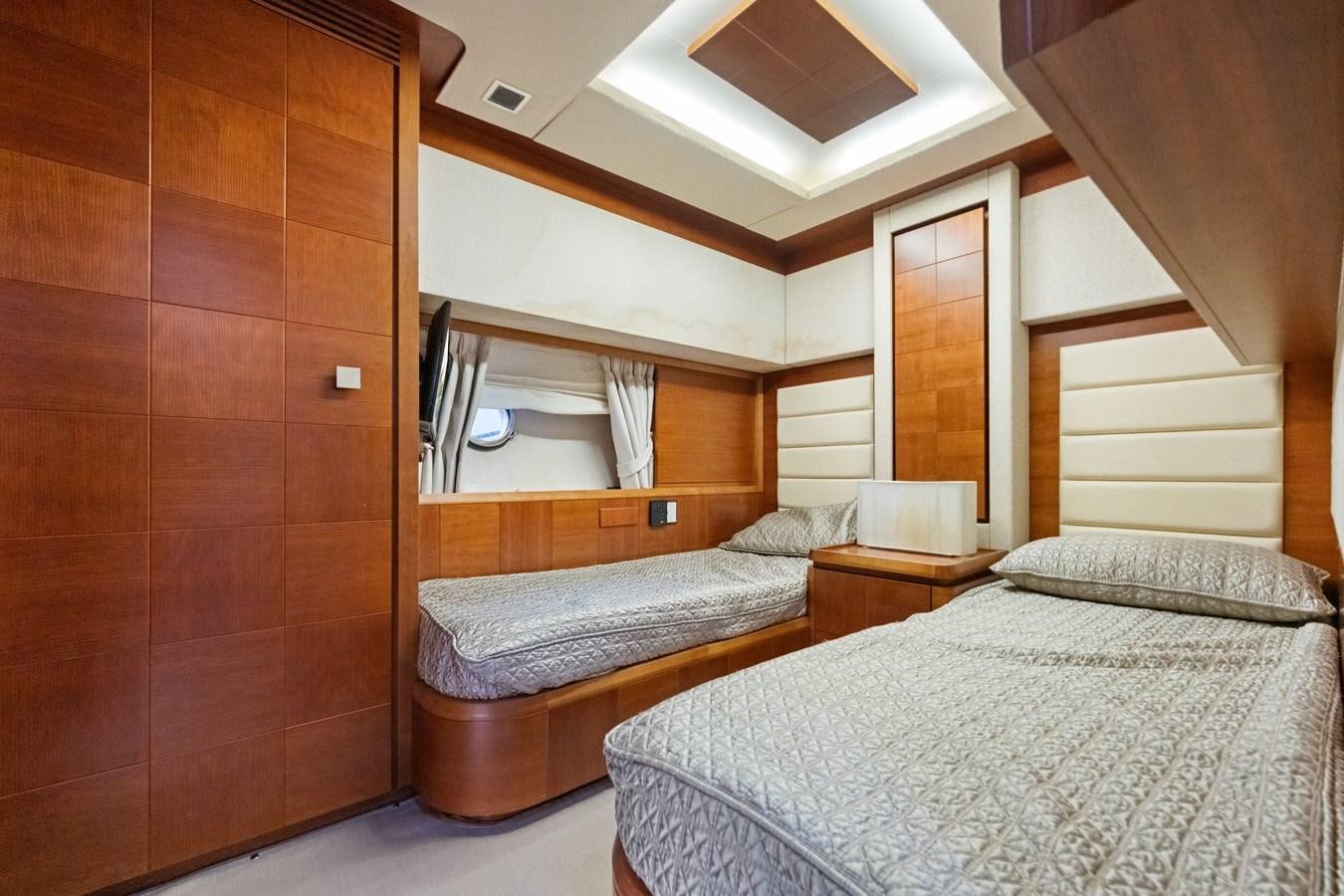 a room with a bed and a mirror aboard AZIMUT 85 FLY Yacht for Sale