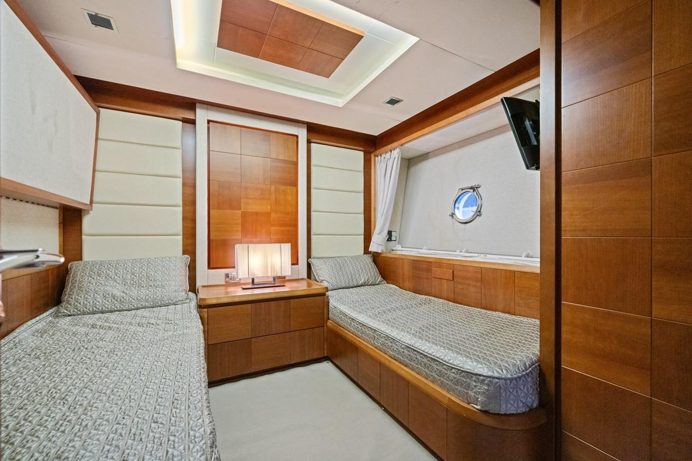a bedroom with a bed and a mirror aboard AZIMUT 85 FLY Yacht for Sale