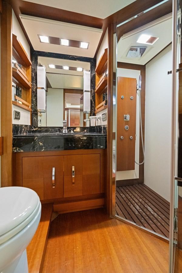 a bathroom with a sink and cabinets aboard AZIMUT 85 FLY Yacht for Sale