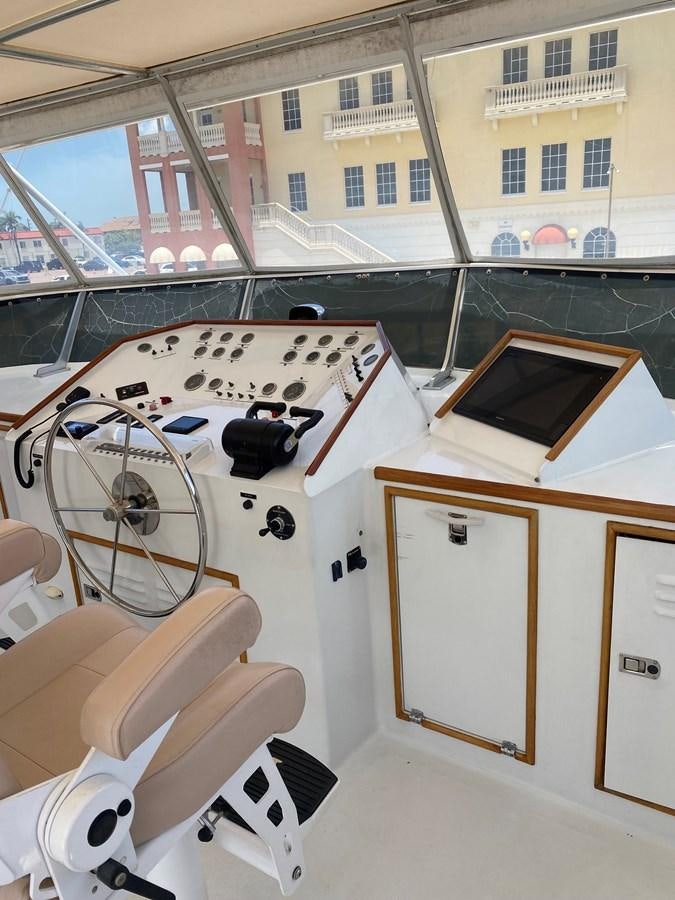 a room with a table and chairs aboard VICTORY Yacht for Sale