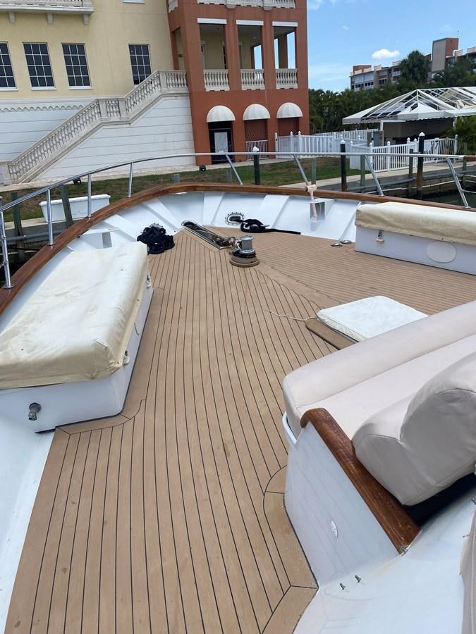 a deck with a bench and chairs aboard VICTORY Yacht for Sale