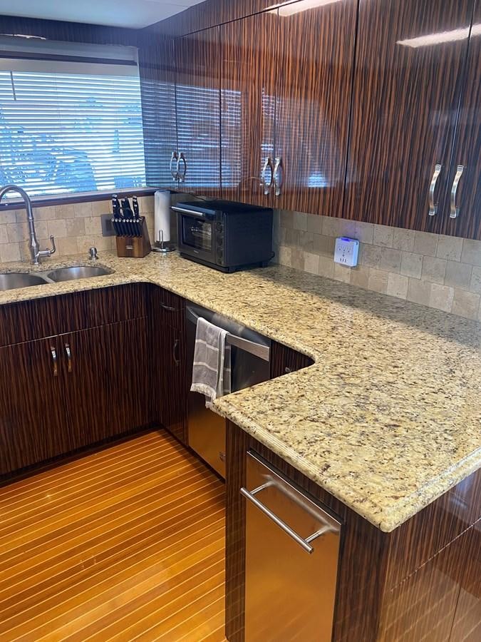 a kitchen with granite counter tops aboard VICTORY Yacht for Sale